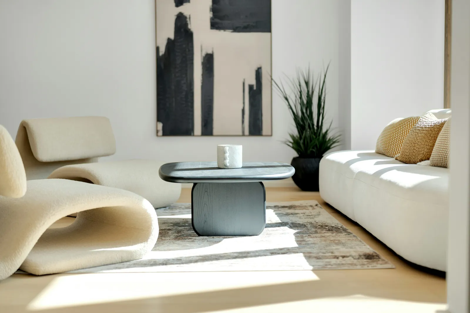 Clean modern living room with a neutral sectional sofa and warm natural light — well-staged interior